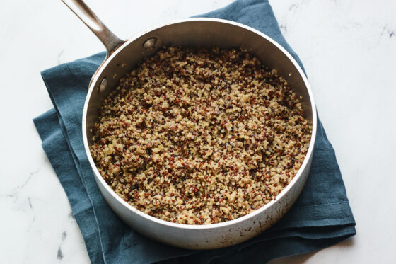 A saucepan with cooked quinoa.