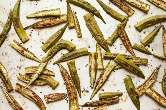 Roasted okra on a baking sheet.