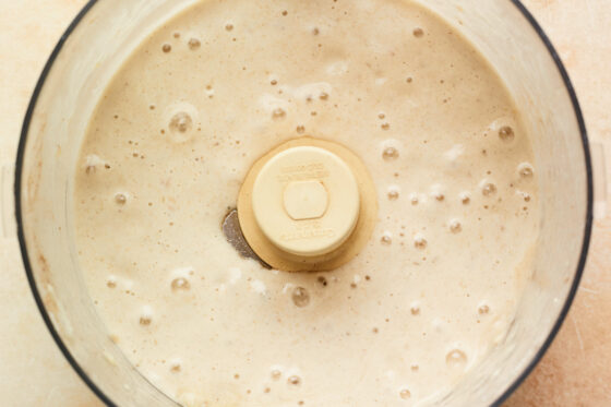 Blended base in a food processor for the vanilla protein ice cream.