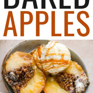 An overhead shot of a baked apple sliced in half with a scoop of ice cream and a caramel drizzle in a shallow bowl with a silver spoon.