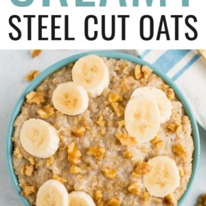 Bowl of steel cut oats topped with walnuts and banana slices.