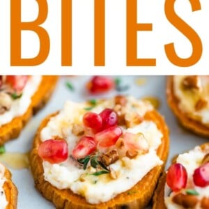 A sweet potato bite topped with pomegranate arils, pecans and fresh thyme is in focus, surrounded by other bites that are not in focus.