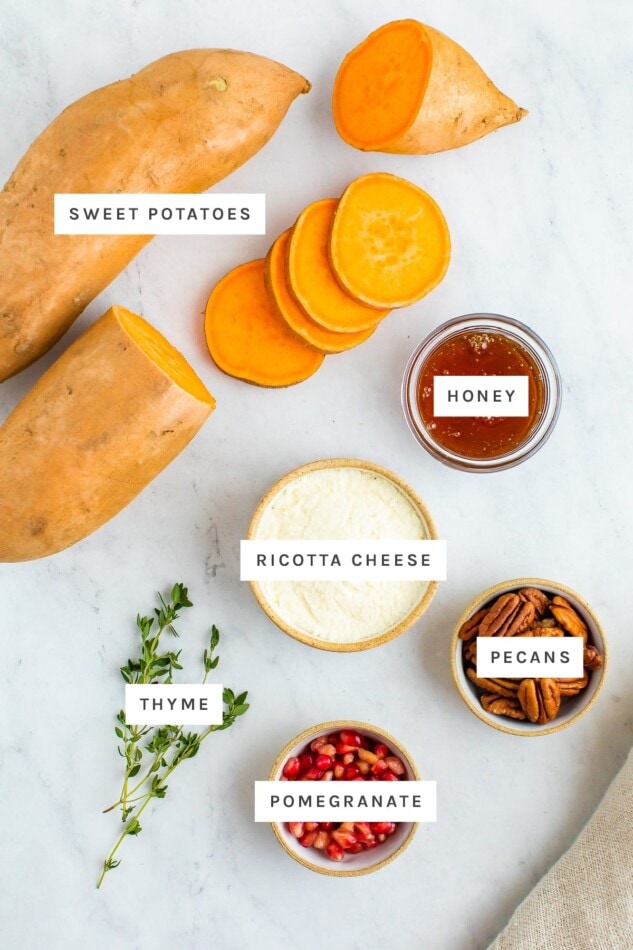 Ingredients measured out to make sweet potato bites: sweet potato, honey, ricotta cheese, pecans, thyme and pomegranate.