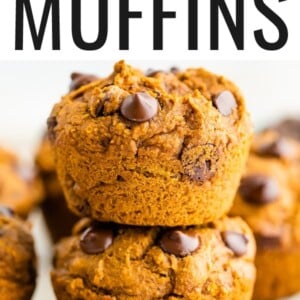 Two chocolate chip pumpkin muffins stacked on top of each other.