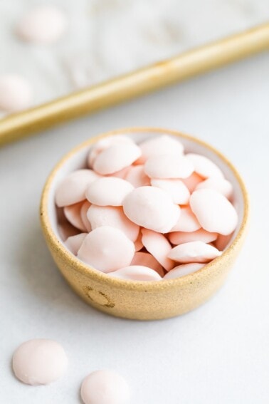 A small dish with small, frozen button-sized yogurt melts.