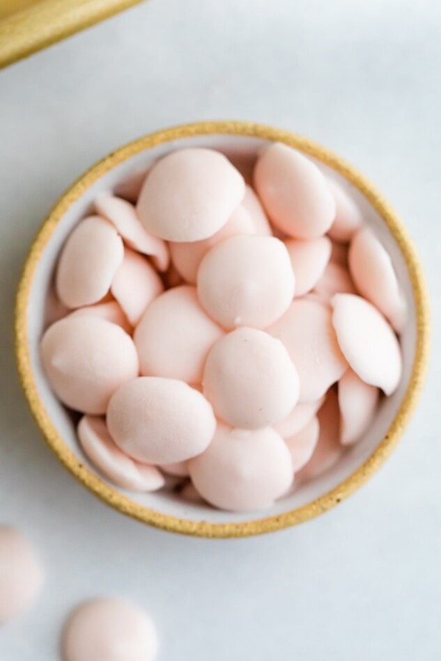 A small dish with small, frozen button-sized yogurt melts.