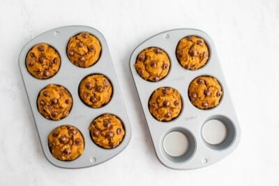 Two 6-muffin baking pans, with 10 baked muffins.