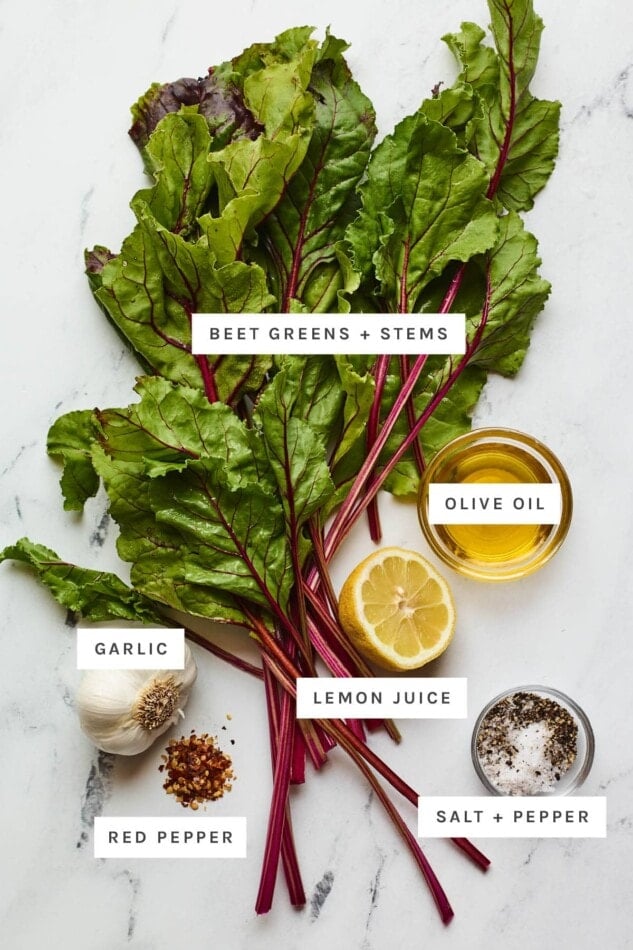 Ingredients measured out to make beet greens: beet greens with stems, olive oil, garlic, lemon juice, red pepper, salt and pepper.