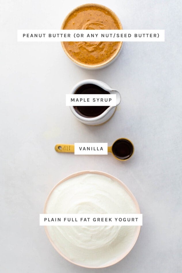 Ingredients measured out to make greek yogurt frosting: peanut butter, maple syrup, vanilla and plain greek yogurt.