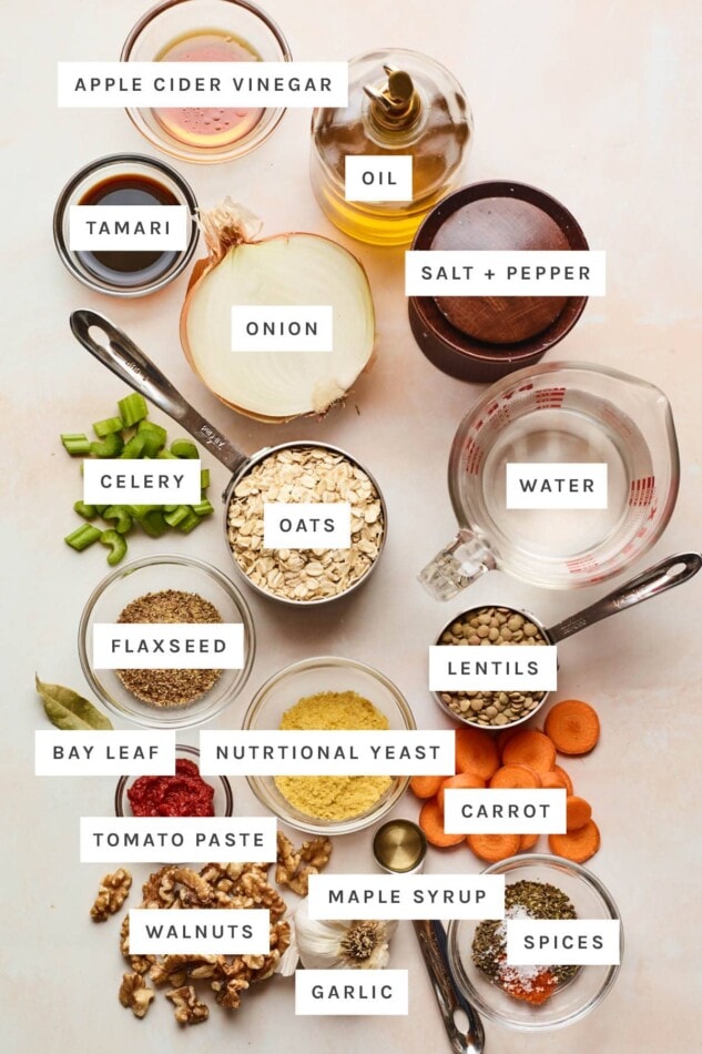 Ingredients measured out to make a lentil loaf: apple cider vinegar, oil, salt, pepper, tamari, onion, water, celery, oats, flaxseed, lentils, bay leaf, nutritional yeast, carrot, tomato paste, maple syrup, spices, walnuts and garlic.