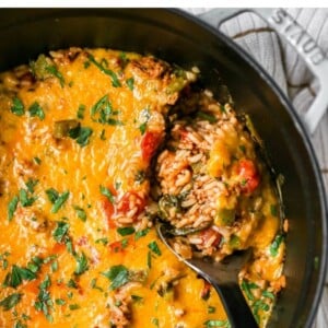 A large pot with stuffed pepper casserole covered in melty cheese. A serving spoon is scooping out a portion of the casserole. Text reads " One Pot Stuffed Pepper Casserole, Easy Weeknight Meal"