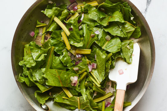 Beet greens and onions sautéed together.