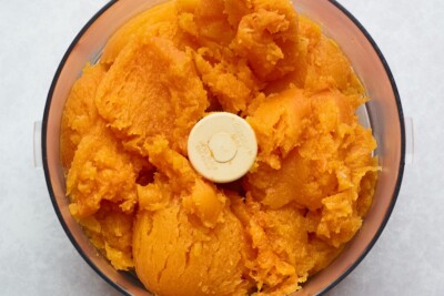 Roasted butternut squash without the skins in a food processor.