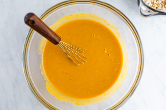 Pumpkin puree, honey, greek yogurt, oil, eggs and vanilla whisked together in a mixing bowl.