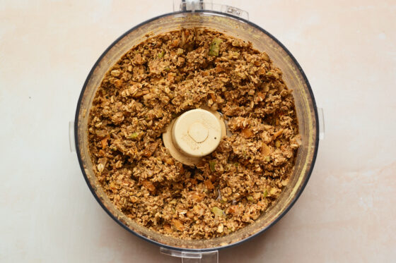 Ingredients for lentil loaf after being blended, inside of a food processor.