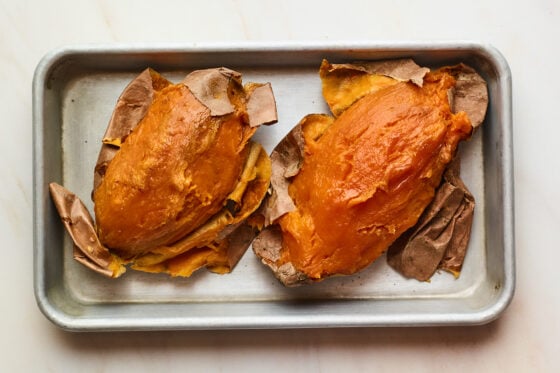 Two baked sweet potatoes with the skins removed.