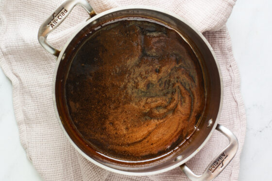A saucepan containing coconut sugar and water.