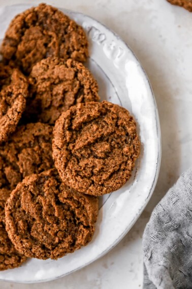 An overhead photo of a plate containing almond butter espresso cookies.