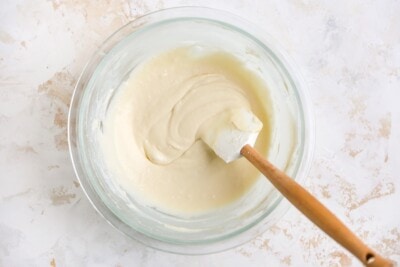 Maple cream cheese frosting in a mixing bowl.