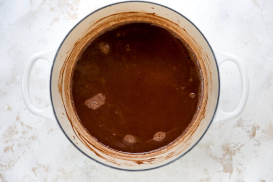 Cocoa mixed into the milk in a sauce pan.