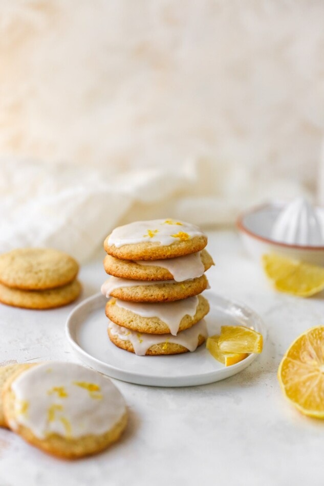 A stack of lemon almond flour cookies on a plate.