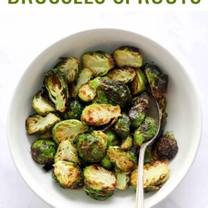Serving bowl and spoon with crispy air fried brussels sprouts.