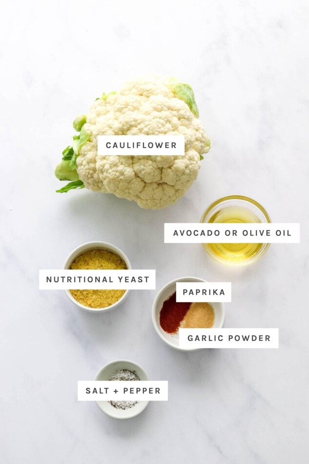 Ingredients measured out to make air fryer cauliflower: cauliflower, oil, nutritional yeast, paprika, garlic powder, salt and pepper.