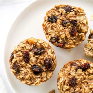 Overhead photo looking down at a plate with 3 banana baked oatmeal cups.