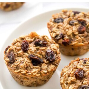 Close up photo of 3 banana baked oatmeal cups on a small plate.