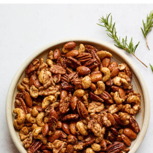 An overhead photo looking at a bowl of sweet and savory party nuts.