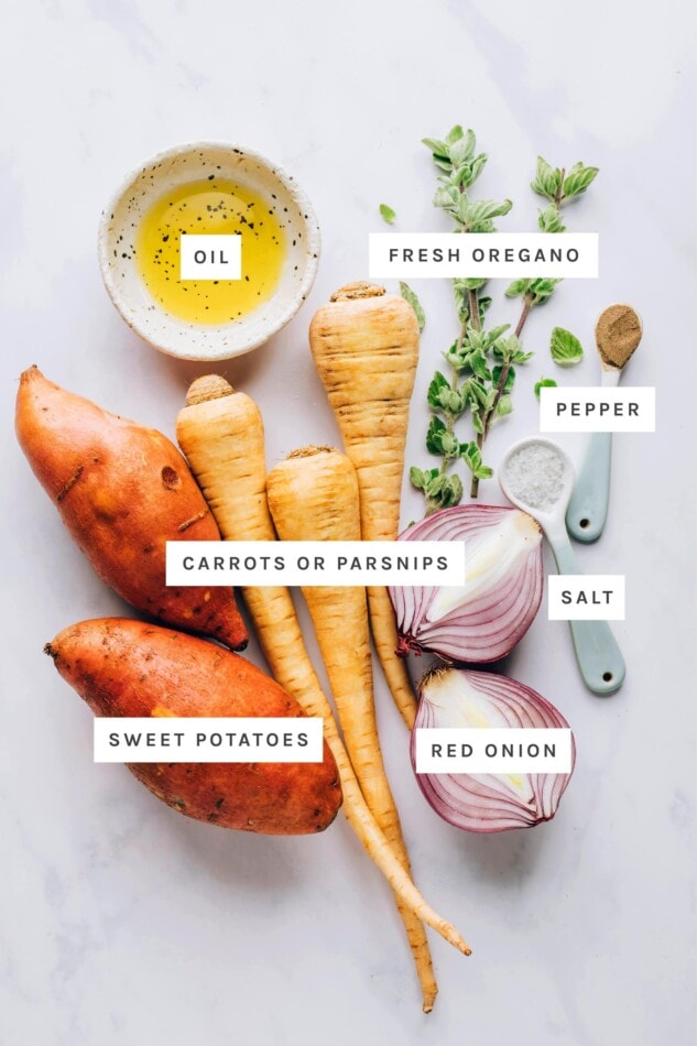 Ingredients measured out to make roasted root vegetables: oil, fresh oregano, pepper, parsnips, sweet potatoes, salt and red onion.