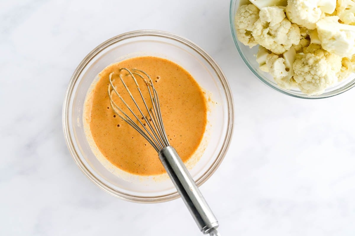 Flour, water, garlic powder, paprika, salt and pepper whisked together in a mixing bowl.