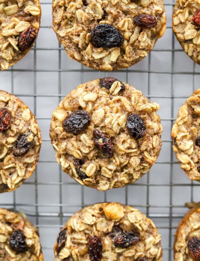 A close up of banana baked oatmeal cups on a wire rack.