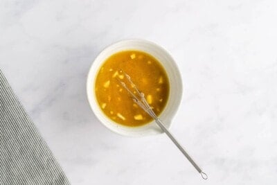 Lemon juice, apple cider vinegar, maple syrup, dijon, garlic, salt, pepper and oil whisked together in a ramekin.