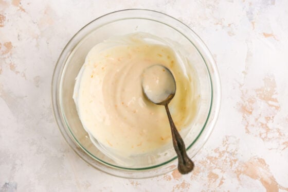 A mixing bowl containing a maple orange glaze.