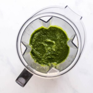 Romaine lettuce and spinach blended together in a blender.