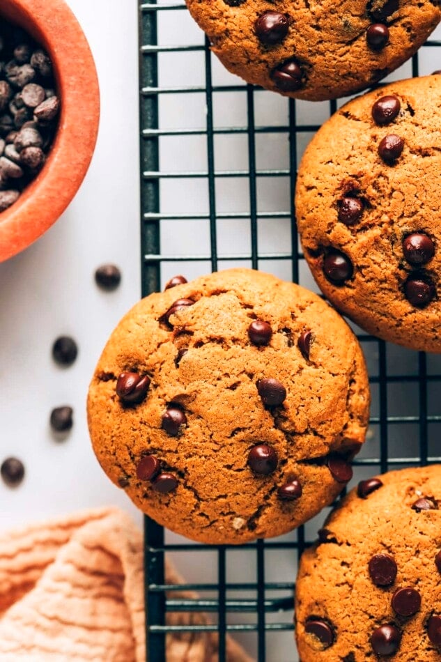 An overhead photo looking down on healthy chocolate chip cookies on a wire cooling rack.