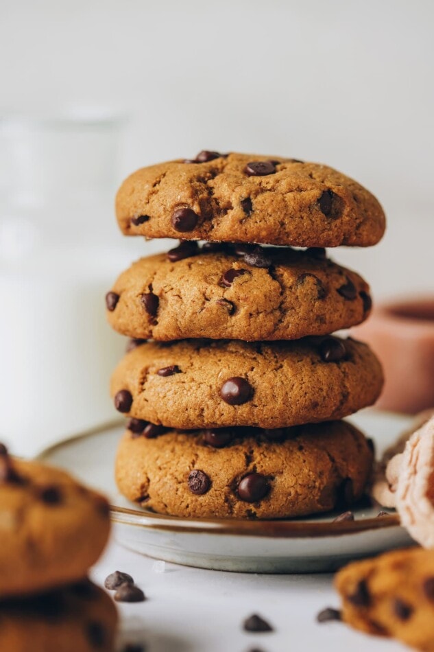 Four healthy chocolate chip cookies stacked on top of eachother.