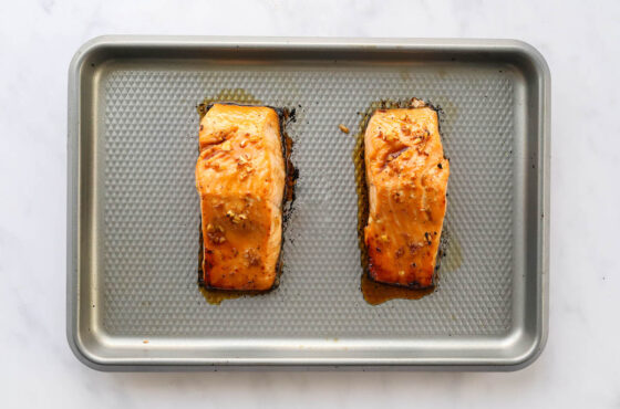 Two broiled maple glazed salmon filets.