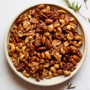 An overhead photo looking at a bowl of sweet and savory party nuts.