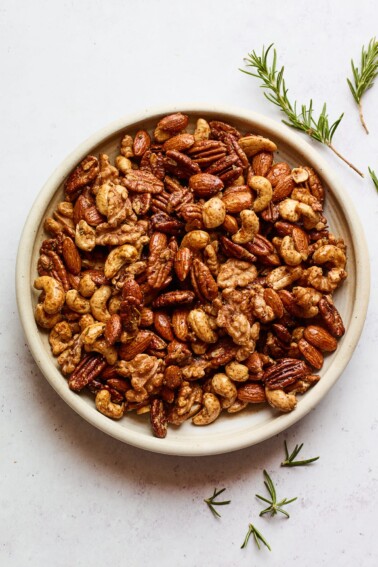 An overhead photo looking at a bowl of sweet and savory party nuts.