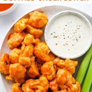 Plate of air fried buffalo cauliflower with ranch and celery.