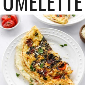 An egg white omelette on a plate, a fork is removing a bite.