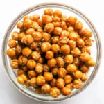 Salted air fried chickpeas in a glass bowl.