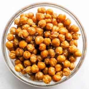 Salted air fried chickpeas in a glass bowl.