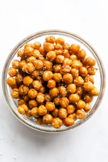 Salted air fried chickpeas in a glass bowl.