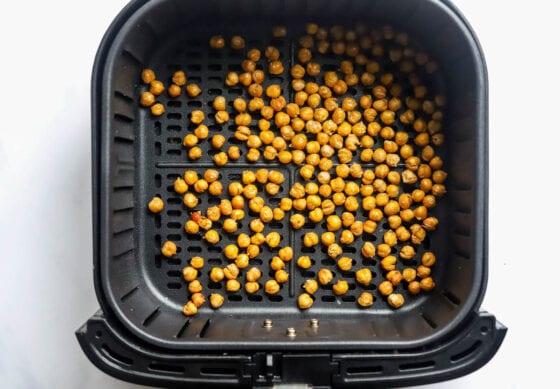 Air fried chickpeas in an air fryer basket.