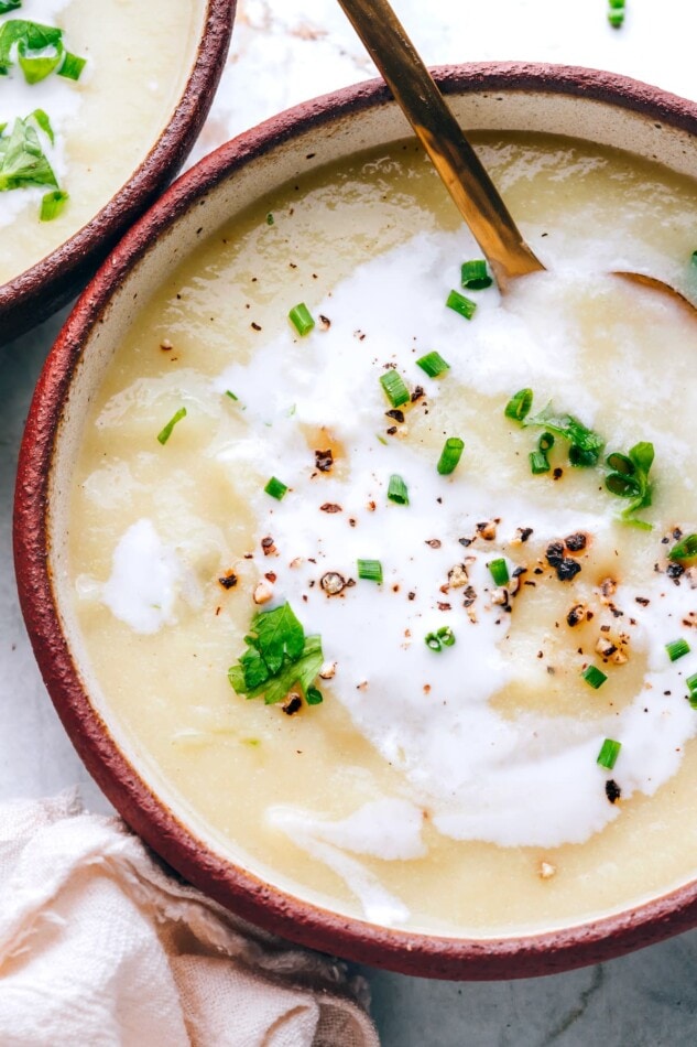 An overhead view of a bowl of cauliflower soup.