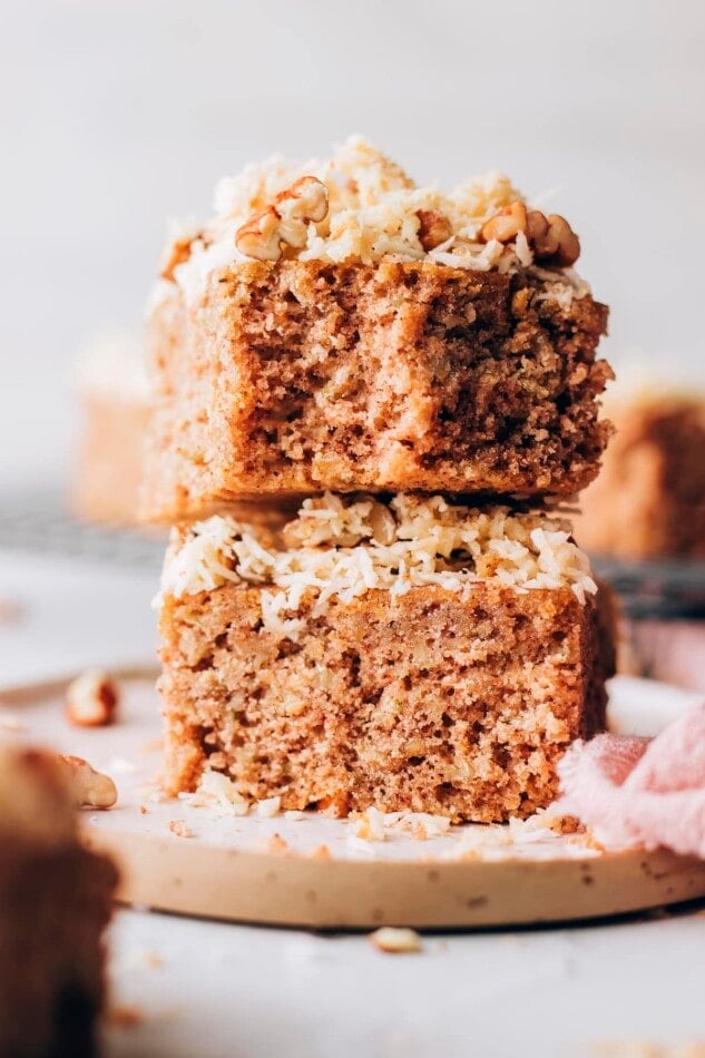 Two pieces of oatmeal cake stacked on top of each other.