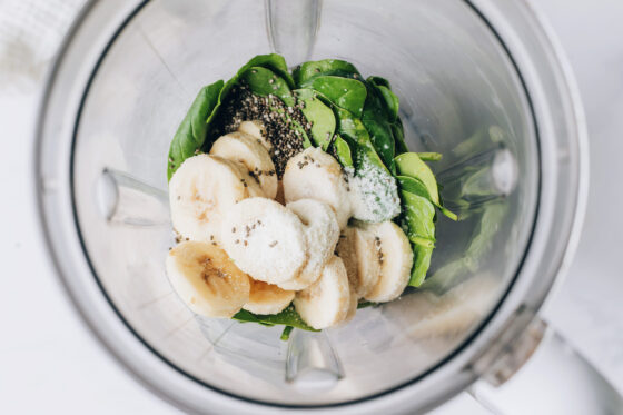 Frozen banana slices, vanilla protein powder, vanilla almond milk, spinach and chia seeds in a high powered blender.